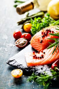 Delicious  portion of  fresh salmon fillet  with aromatic herbs,