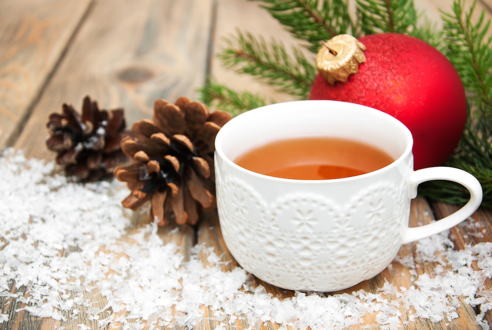 Cup of tea with christmas tree and bauble