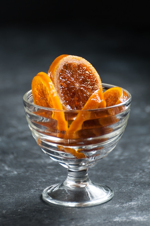 Caramelized oranges in a delicate glass crockery.